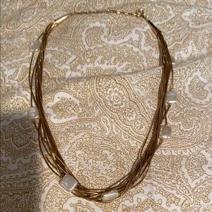 Pretty gold multi stranded necklace with mother of Pearl stones